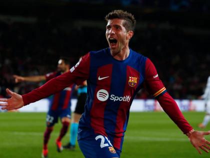 AP 
Barcelona’s Sergi Roberto celebrates his side’s third goal scored by Barcelona’s Robert Lewandowski during the Champions League, round of 16, second-leg football match against SSC Napoli at the Olympic Stadium in Barcelona, Spain, March 12, 2024.