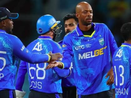 St Lucia captain Roston Chase celebrates with teammates after victory over the Antigua & Barbuda Falcons in the Republic Bank Caribbean Premier League on Sunday.