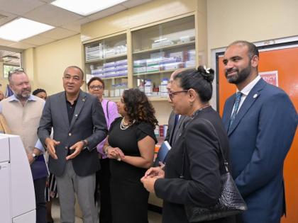 Minister of Health and Wellness Dr Christopher Tufton (second left), emphasises the benefits of the antimicrobial resistance (AMR) regional reference referral laboratory of the Caribbean Public Health Agency (CARPHA) at the recent official opening of the f