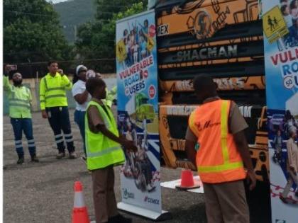 Students of Rollington Town Primary School in Kingston participate in a Vulnerable Road User Initiative hosted by Caribbean Cement Company Limited at the school, on June 17.