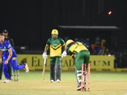 Jamaica Kingsmen’s Kirk McKenzie Jr (right) is bowled for a duck by DR Sams (left) from the Barbados Trident during their Caribbean Premier League T20 cricket match at Sabina Park on Tuesday.