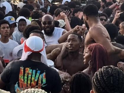 A screenshot from a video of a brawl at the Zimi Seh Beach party held at Puerto Seco Beach in Discovery Bay, St Ann