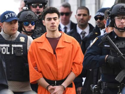 Luigi Mangione is escorted by police, December 19, 2024, in New York. 