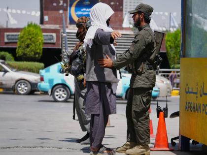 A Taliban security officer searches a man at a checkpoint ahead of celebrations marking the fifth anniversary of the US withdrawal from Afghanistan and the start of Taliban rule, in Kabul, Afghanistan, last Thursday.