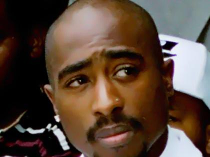 Rapper Tupac Shakur attends a voter registration event in South Central Los Angeles, August 15, 1996. 