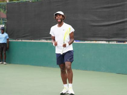 Andrew Fenty in action at the Liguanea Club yesterday.