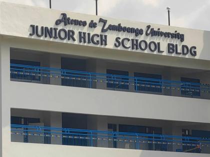A guard secures an area at the junior high school building on the Ateneo de Zamboanga University campus following a shooting incident in Zamboanga, southern Philippines Tuesday, Aug. 18, 2026. (AP Photo)