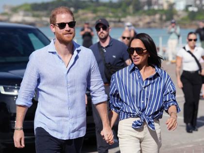Prince Harry (left) and Meghan, the Duke and Duchess of Sussex. 