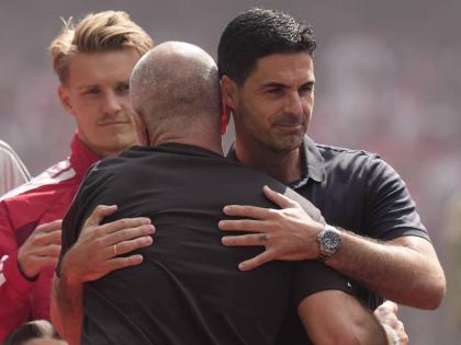 Arsenal’s manager Mikel Arteta (right) hugs Manchester City’s head coach Enzo Maresca prior to the FA Community Shield final soccer match in Cardiff, Wales, on Sunday.