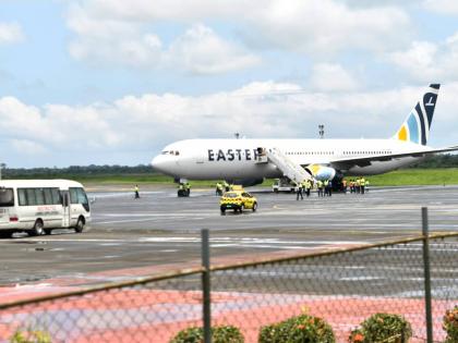 Plane carrying the deportees from the US arrives at the Roberts International Airport outside of Monrovia, Liberia, Thursday.