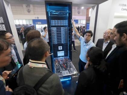 Visitors listen to the introduction o NVIDIA GB300 NVL72 AI server during the Hon Hai Tech Day in Taipei, Taiwan, November 21, 2025.