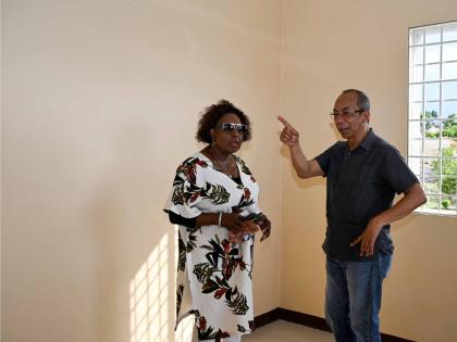 Minister of Culture, Gender, Entertainment and Sport, Olivia Grange, and Deputy Prime Minister and Minister of National Security and Peace, Dr Horace Chang, in discussion as they tour the newly completed third shelter for women experiencing abuse. - Contri