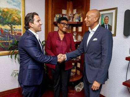 Jabar Singh (left), president, Scotiabank Dominican Republic and the Caribbean, is introduced to David Lowe, managing director of the Development Bank of Jamaica by Audrey Tugwell Henry, president and CEO, Scotia Group Jamaica.