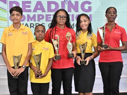 The Jamaica Library Service (JLS) National Reading Competition champions for 2026 (from left) Yash Makhijani, of the 9-11 age group; Liam Williams, of the 6-8 age group; Haley Clarke, of the 15-20 age group; Yandi Burke, of the 12-14 age group; and Sashana