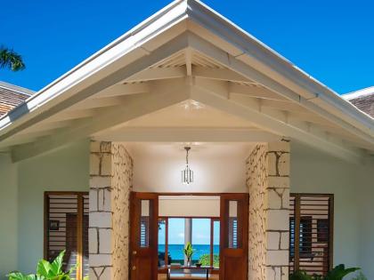 Enter through the front door and walk straight across the house to the seafront. 