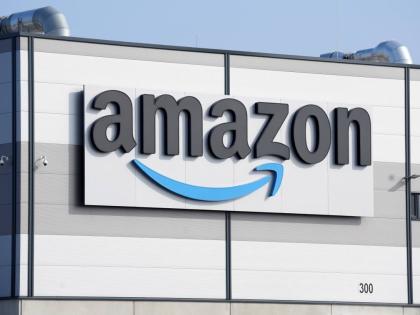 FILE - An Amazon company logo marks the facade of a building, March 18, 2022, in Schoenefeld near Berlin. (AP Photo/Michael Sohn, File)
