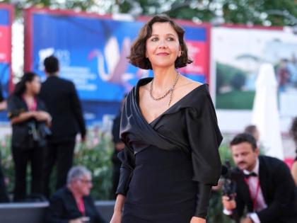 Jury president Maggie Gyllenhaal arrives in Celine for the festival’s red-carpet affair.