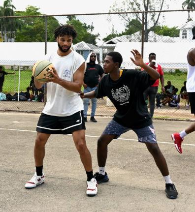 Denver Nuggets’ Jamal Murray (left) and Vauxhall High’s Damarian Taylor at the Jamal Murray Basketball Camp held at Mount Alvernia High last weekend.