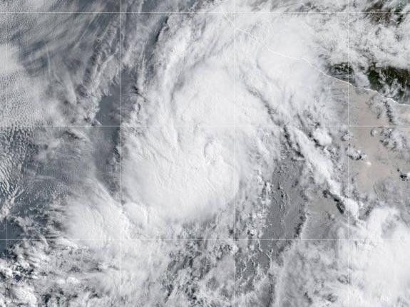 The weather service predicted little change in strength over the next couple of days but said the storm could intensify over the weekend.