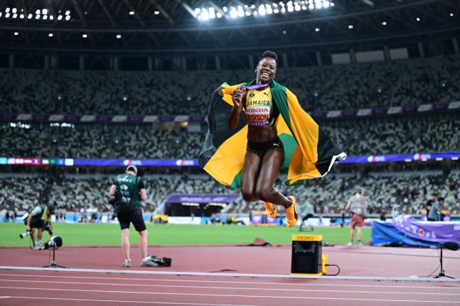 Shericka Jackson celebrates the bronze medal she won in the women's 200 metres at the World Athletics Championships inside the Japan National Stadium earlier.