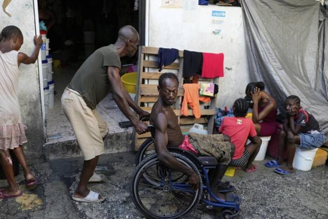 People displaced by gang violence spend time at a makeshift shelter in Port-au-Prince, Haiti on Wednesday.