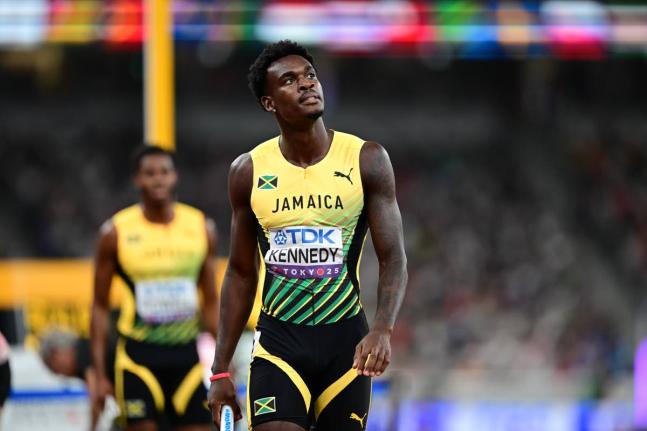Jamaica's Delano Kennedy looks up at the clock after his leg of a men's 4x400-metre relay heat put his team in contention to qualify for the World Athletics Championship final at the Japan National Stadium. 
