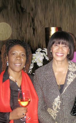 
Then Prime Minister Portia Simpson Miller (right) poses with birthday girl Pamela Redwood at her party in this January 2013 photo.