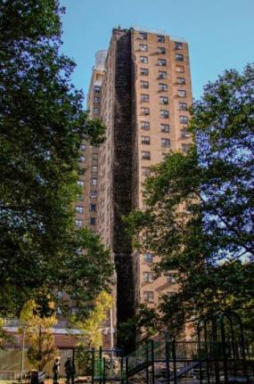 Firefighters work near the site of a building collapse in the Bronx borough of New York, Wednesday, October 1, 2025.
