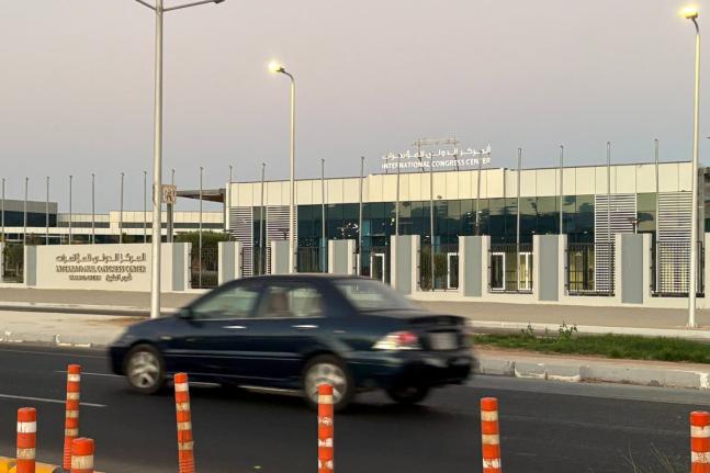 A vehicle passes in front of the International Conference Center where Israeli and Hamas officials are set to hold indirect talks Wednesday, October 8, 2025. (AP Photo)