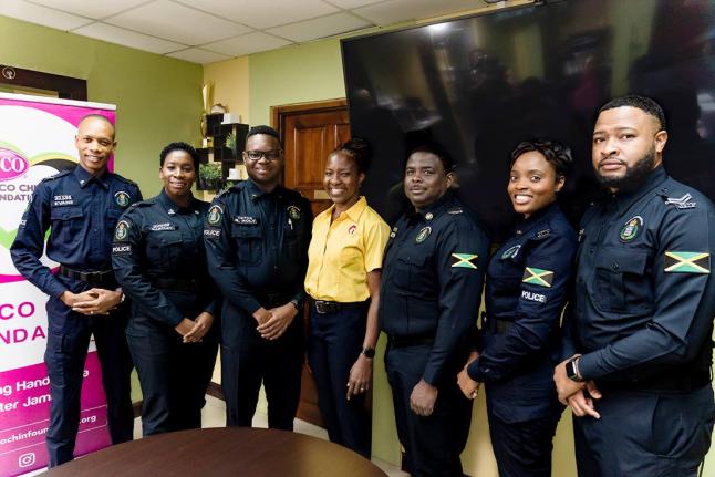 Paula-Anne Porter Jones (centre), communications specialist and lead instructor at PAP & Associates, stands with the ‘super six’ finalists of the 2025-2026 LASCO/JCF Saluting Our Heroes Awards. From left: Detective Corporal Livey Evans (non-geographica