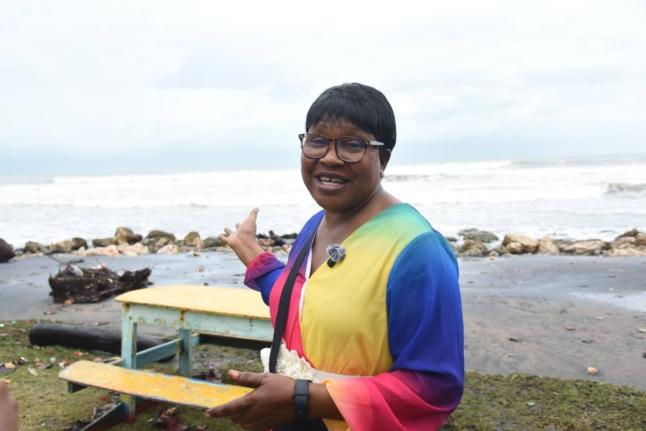 Sixty-one-year-old Barbara Mason, an Antiguan visiting Jamaica for a family event, watches the rising tides at Alligator Pond in Manchester on October 26, 2025 as outer bands from Hurricane Melissa lash the island’s southern coast with heavy rain and str