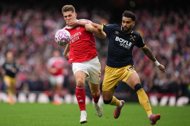 Arsenal’s Viktor Gyoekeres (left) and West Ham’s Lucas Paqueta challenge for the ball during the English Premier League match between Arsenal and West Ham United at the Emirates stadium in London, on October 4, 2025.