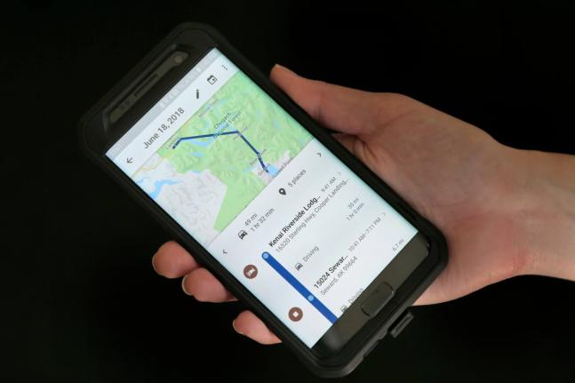 A mobile phone displays a user’s travels using Google Maps.
