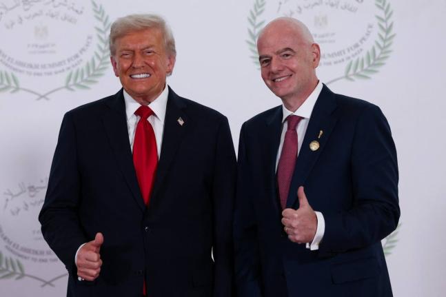 President Donald Trump (left) and FIFA President Gianni Infantino pose for a photo in Sharm el-Sheikh, Egypt on Monday, October 13.