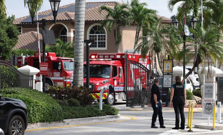 Emergency personnel from Coral Springs and Coconut Creek on scene where a plane crashed in the Windsor Bay community in Coral Springs on Monday, November 10, 2025. (Carline Jean/South Florida Sun-Sentinel via AP)
