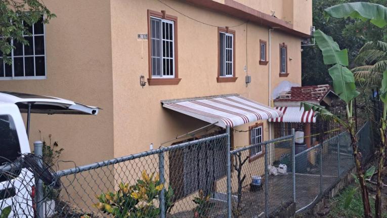 The home of school teacher Tara Pinnock and her daughter Talia Wright in Mount View Estate in Spanish Town, St Catherine, where their bodies were found with stab wounds and their throats slashed on Thursday, November 13, 2025.