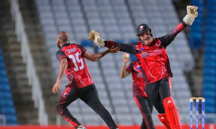 
The Trinidad and Tobago Red Force’s Yannic Cariah (left) celebrates one of the four wickets he took, inclusive of a hat trick against the Jamaica Scorpions at the Brian Lara Cricket Academy in Toruba on Friday. Celebrating with him is his captain, Joshu