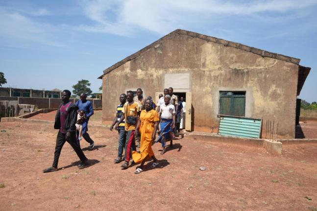 People who were kidnapped during a church service in November 2024 leave after a church meeting in Kaduna, northwestern Nigeria.