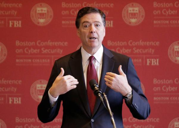 FBI Director James Comey gestures as he speaks on cyber security at the first Boston Conference of Cyber Security at Boston College, March 8, 2017, in Boston. (AP Photo/Stephan Savoia, File)