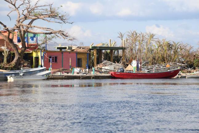 Boats are seen along the banks of the Black River in St Elizabeth on November 20, 2025. Hurricane Melissa, which hit Jamaica on October 28 has disrupted river tours and other business activity.