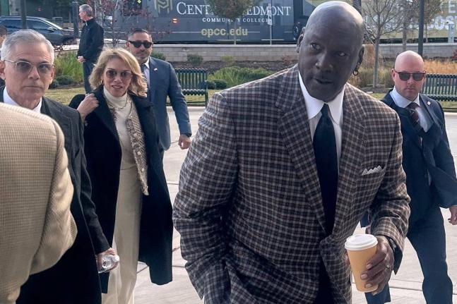 Michael Jordan arrives in the Western District of North Carolina yesterday for the start of the antitrust trial between 23XI Racing and Front Row Motorsports against NASCAR, in Charlotte, NC.