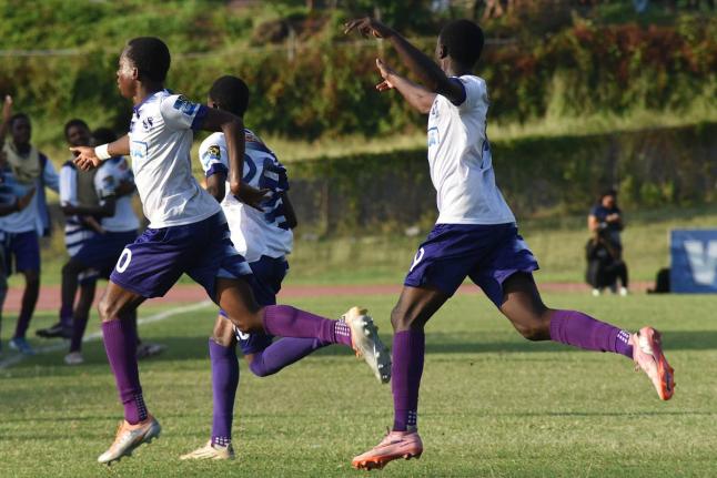 Kingston College’s players react after scoring against Calabar High during their Manning Cup football match  at the National Stadium East field on Wednesday. The game ended in a 2-2 draw.