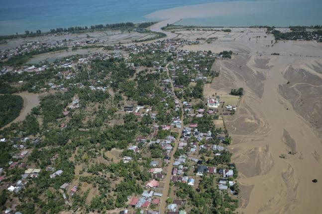 This aerial photo taken from a national disaster mitigation agency's helicopter during an aerial aid distribution shows an area affected by floods in Pidie Jaya, Aceh province, Indonesia on December 4, 2025. 