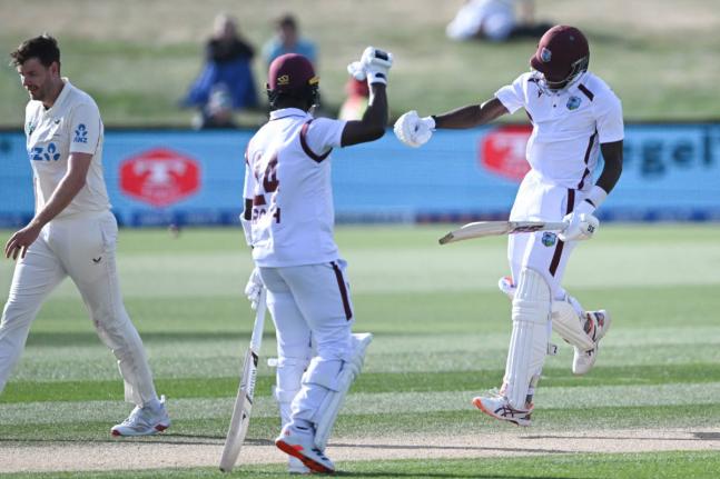 
West Indies’ Justin Greaves (right) celebrates with teammate Kemar Roach (centre) after scoring 200 runs against New Zealand on day five of their Test match in Christchurch, New Zealand, on Friday. 
