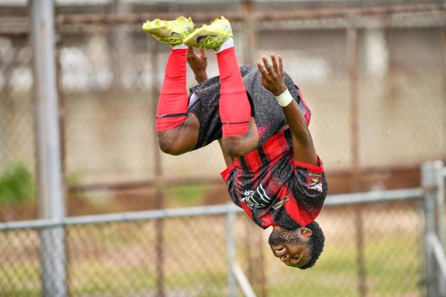 Matthew McKoy/Photographer 
Rushike Kelson of Arnett Gardens FC somersaults as he celebrates scoring a goal.
