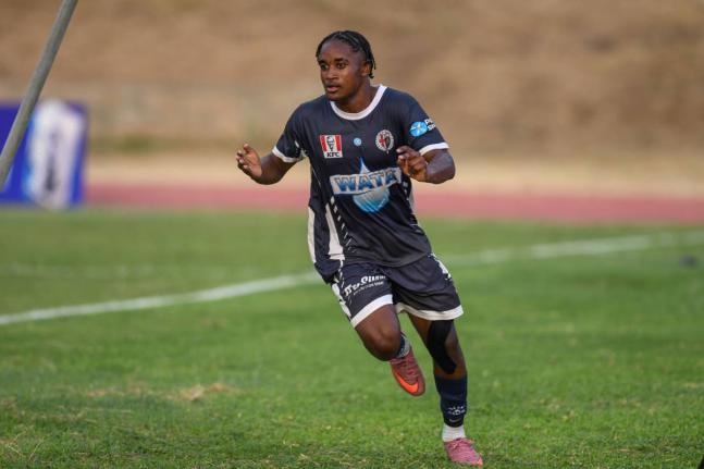 Jamaica College’s (JC) Jabarie Howell celebrates scoring one of the two goals he had against Charlie Smith during an ISSA/WATA Manning Cup football match against Charlie Smith at the Stadium East field yesterday. JC won the game 4-0.