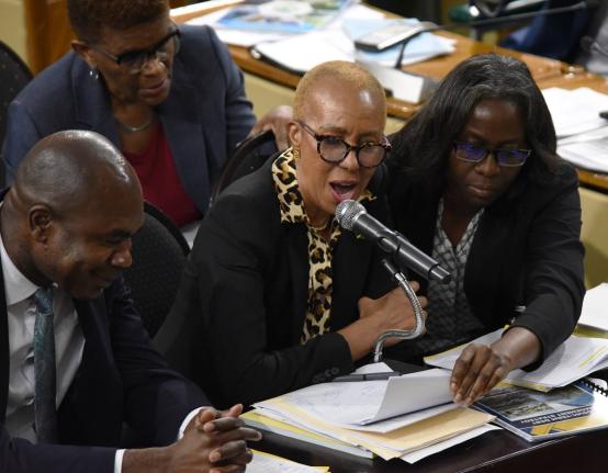 Fayval Williams (centre), minister of the finance and the public Service, answers questions during yesterday’s sitting of the Standing Finance Committee of Parliament as Financial Secretary Darlene Morrison and Zavia Mayne, state minister in the finance 