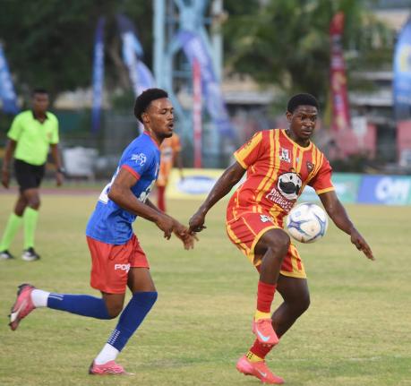 Cornwall College’s Marcane Gooden (right) tries to get the ball under control ahead of Kemps Hill High’s Orlando Campbell in a previous daCosta Cup encounter between the teams at the Montego Bay Sports Complex on October 11. Kemps Hill won yesterday’