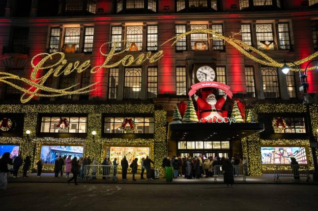 Black Friday shoppers wait in line to enter Macy’s flagship store in New York.
