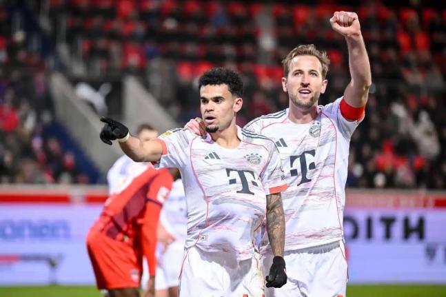 Bayern’s Luis Díaz (left) celebrates with Harry Kane after scoring their side’s third goal of the game during the Bundesliga match between FC Heidenheim and Bayern Munich in Heidenheim, Germany, yesterday.